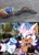 Size: 1200x1675 | Tagged: safe, artist:mitzeenr, knuckles the echidna, rouge the bat, bat, echidna, human, literal animal, pepsi, photo background